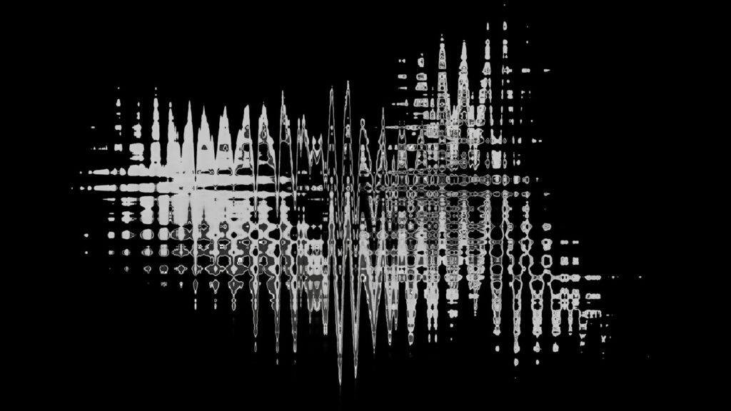 A black and white photo of a cross on a black background